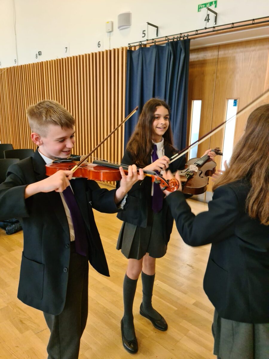 Students playing musical instruments