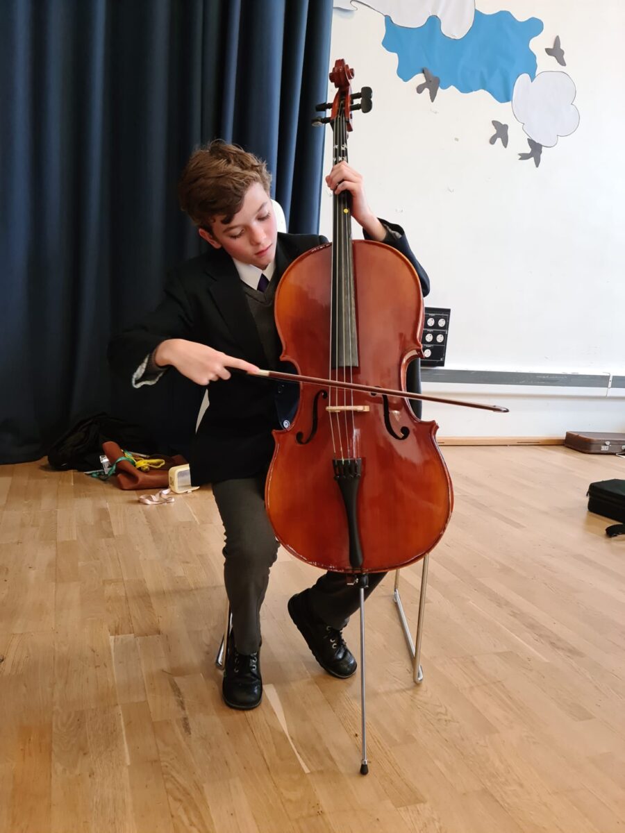 Student playing musical instrument