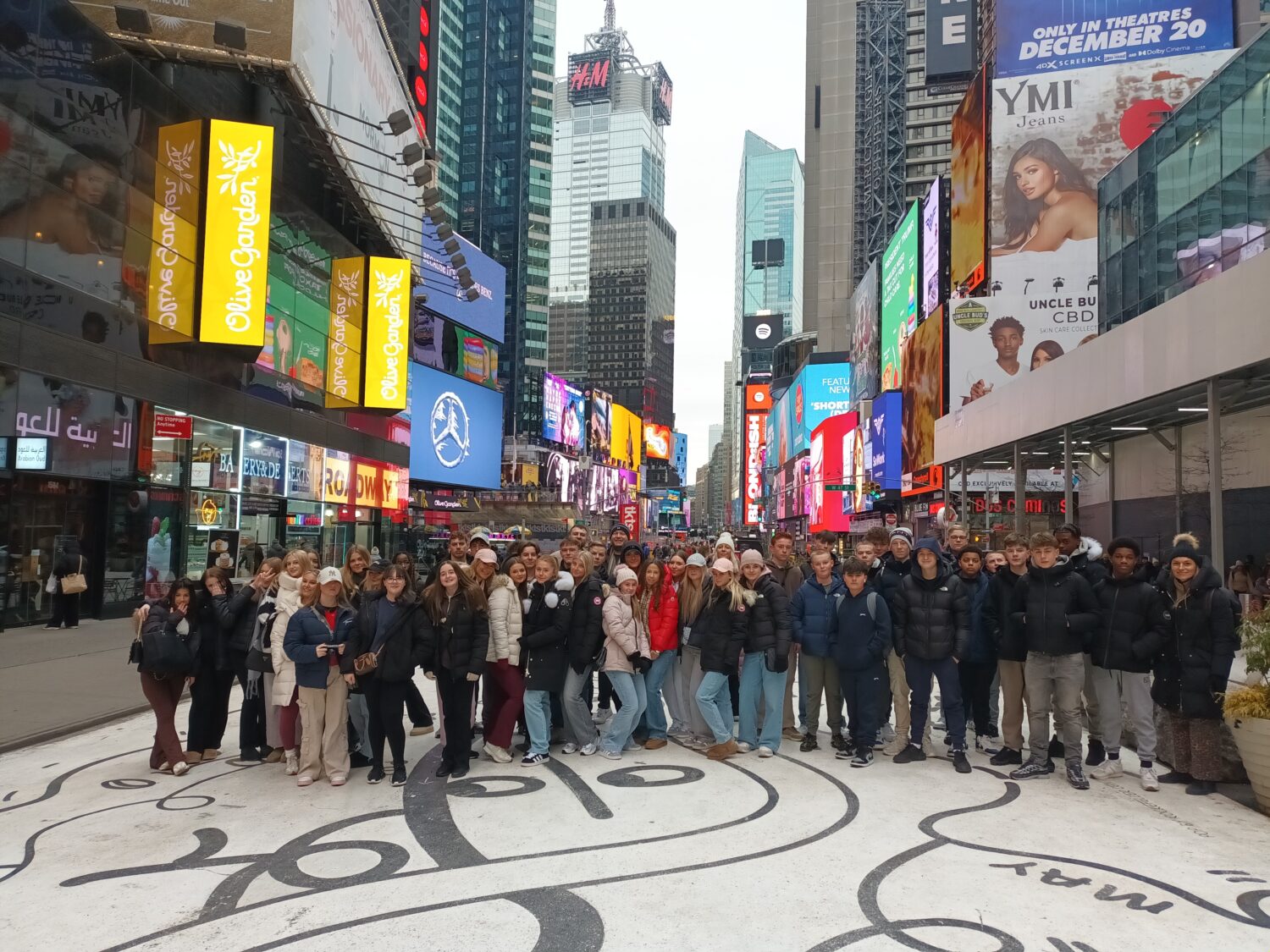 Group of all students stood in Times Square, New York City