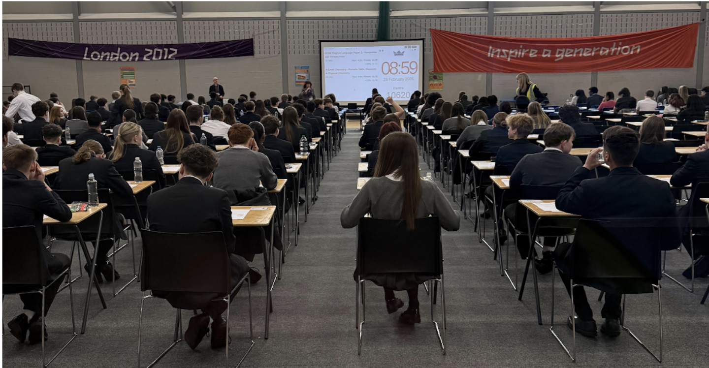 Students sat in an exam hall