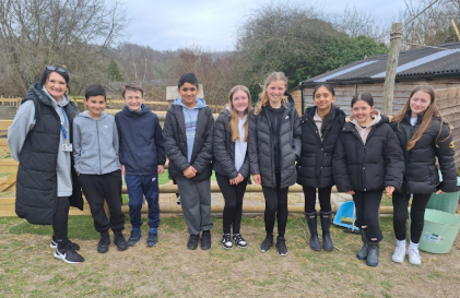 Students stood together at an alpaca farm