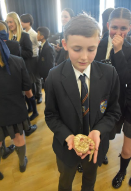 Student holding snake