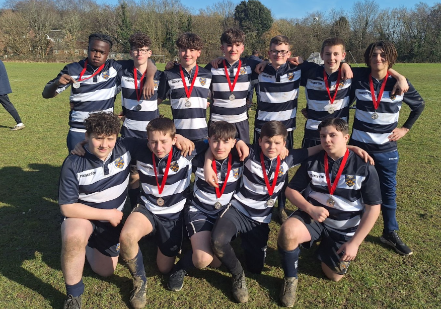 Rugby players posing after a match