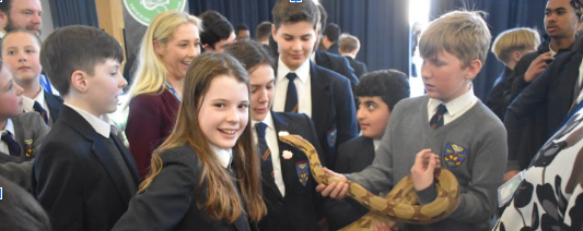 Students holding snake