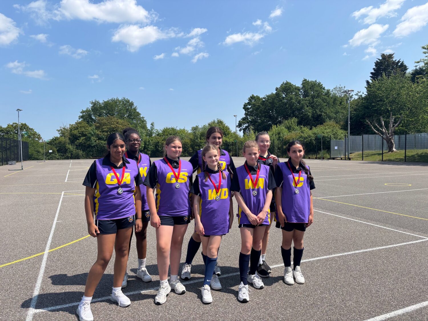 Year 7 netball team with their medals