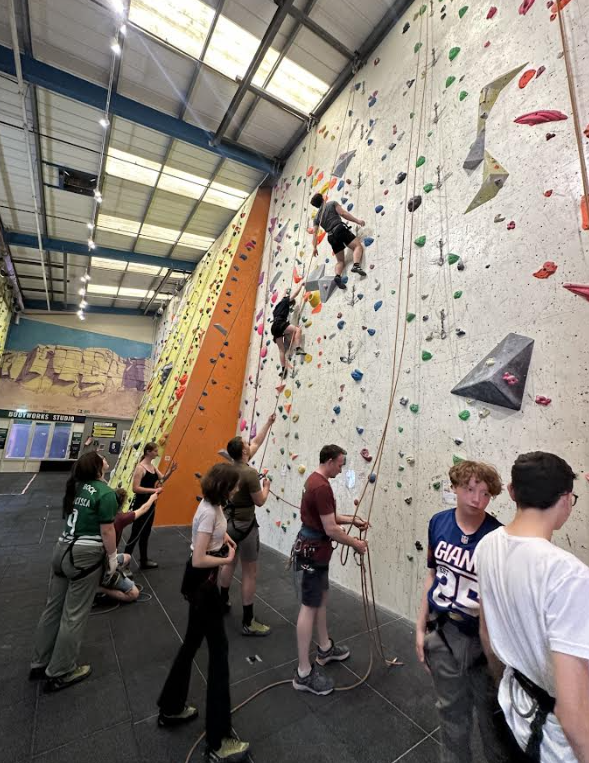 Children tackle an indoor climbing wall