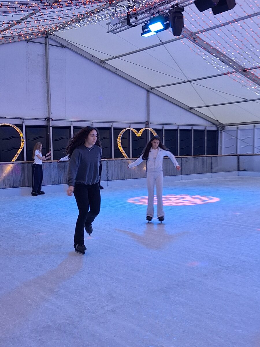 Two girls on the ice, skating