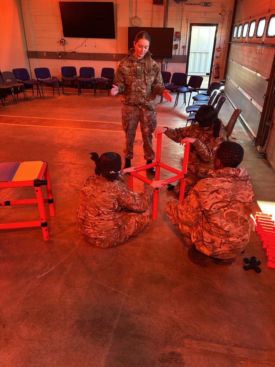 Cadets pictured receiving instruction on how to build a chair