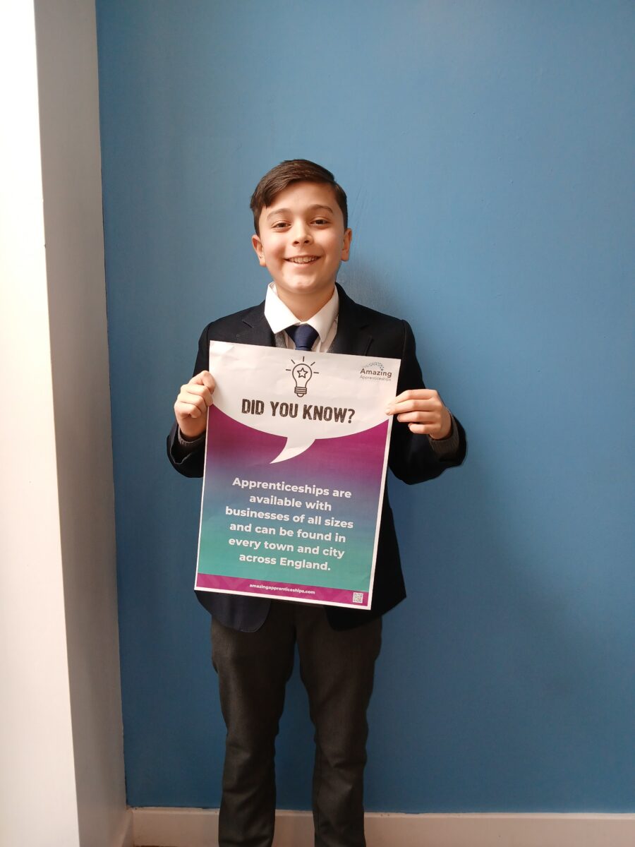 A student holding a poster