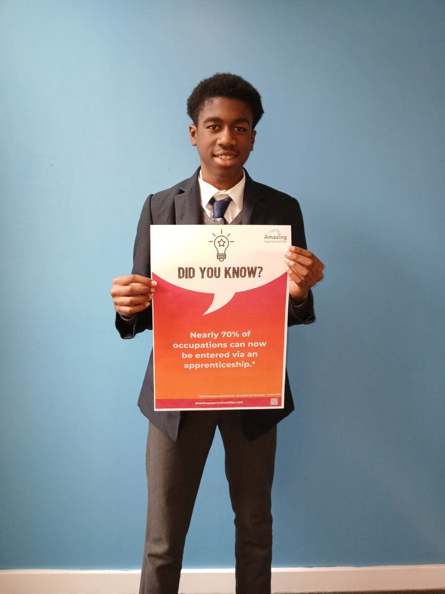 A student holding a poster